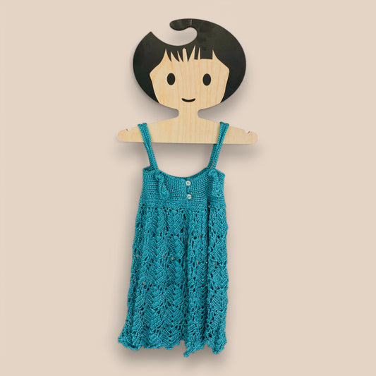 back side of hand crochet turquoise dress
