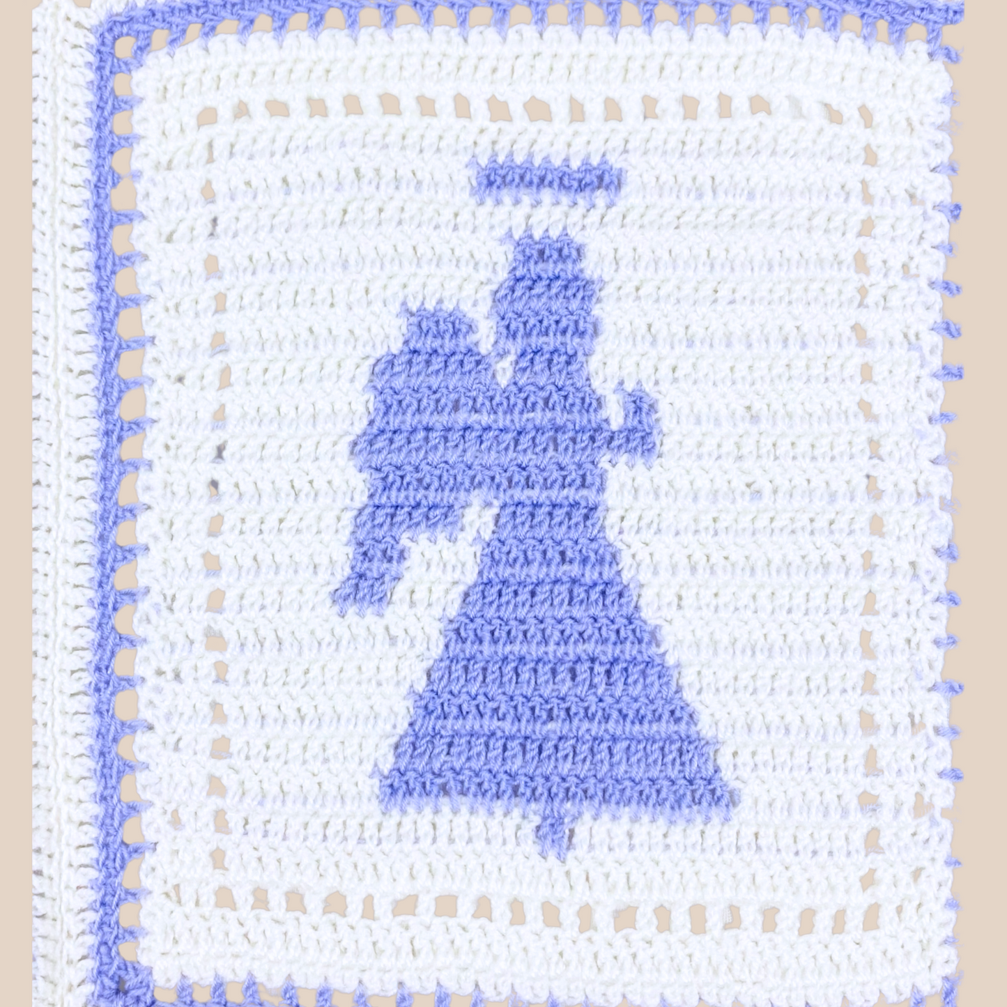 close of crochet angel motif on blanket