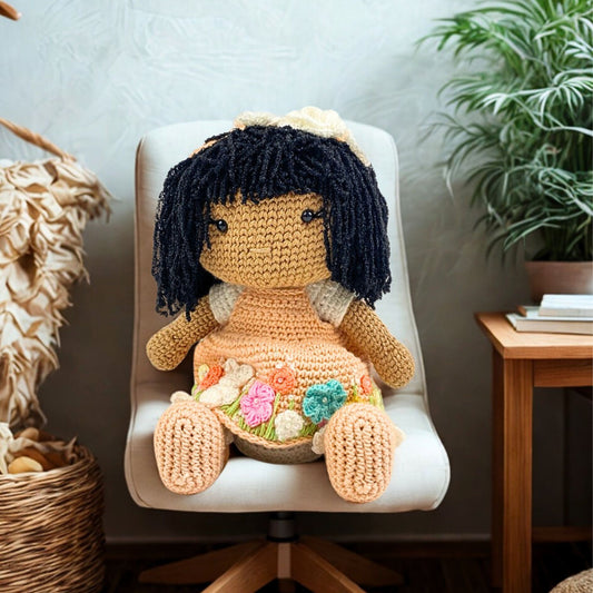 Handmade amigurumi 12 inch crochet doll with black yarn hair and floral peach dress, perfect for your kids