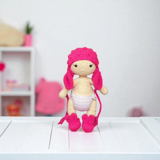 crocheted doll with pink mouse ear cap ,white diaper pants and pink shoes