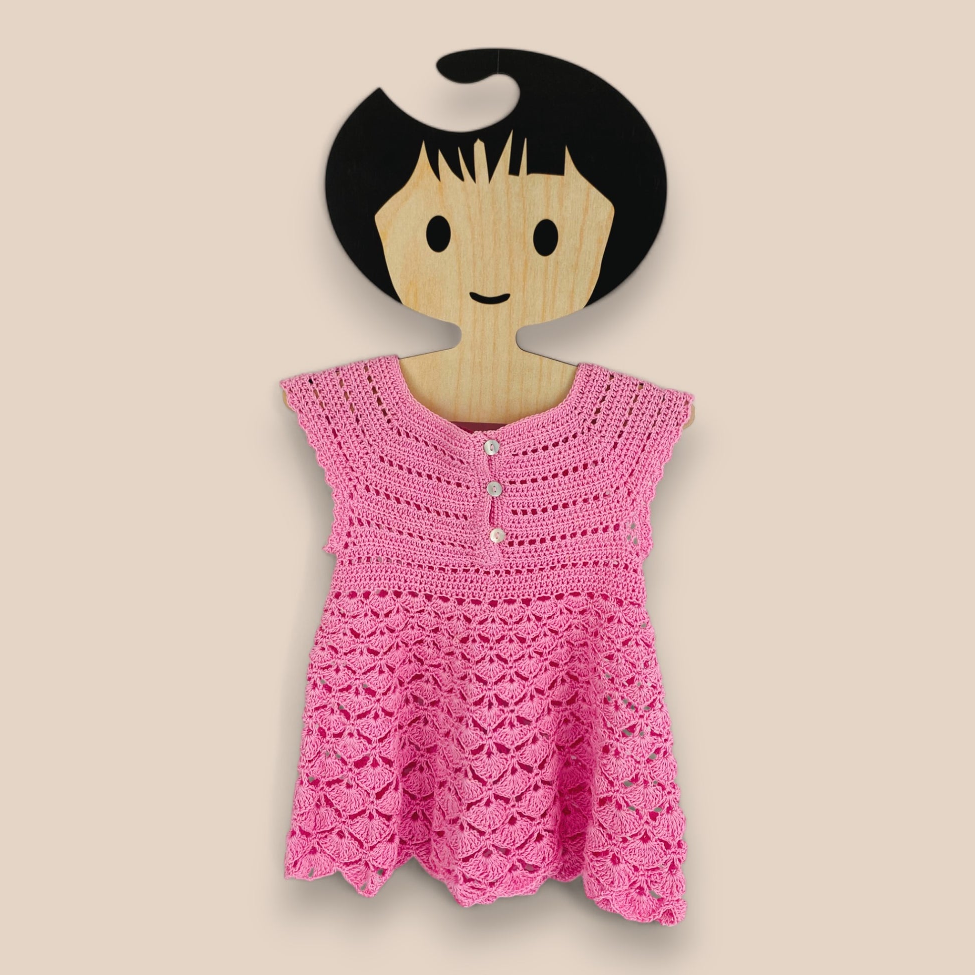 back view of pink crochet cotton baby dress