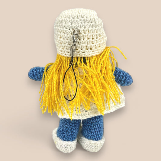 Backview of Handmade amigurumi crochet toy in pastel colors, perfect as a baby crib toy, stroller accessory, or cute bag charm gift.

