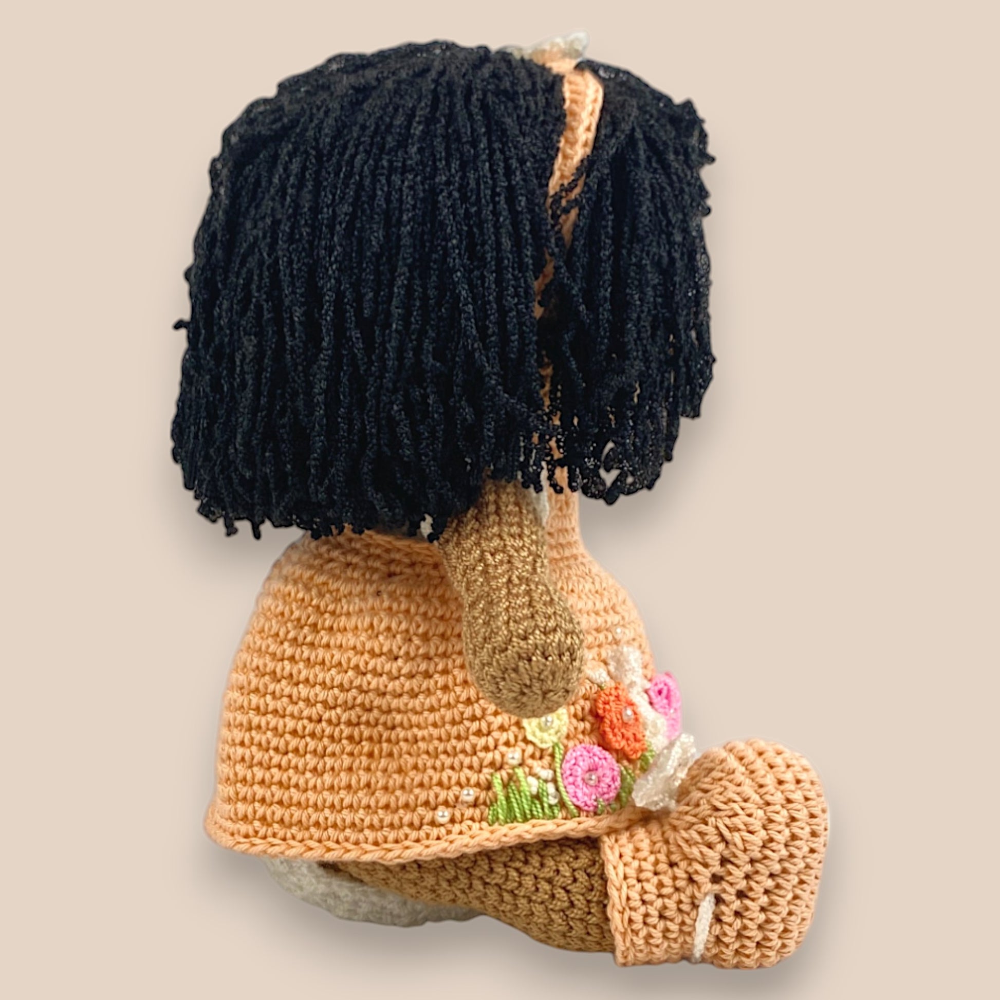 another side view of crochet doll