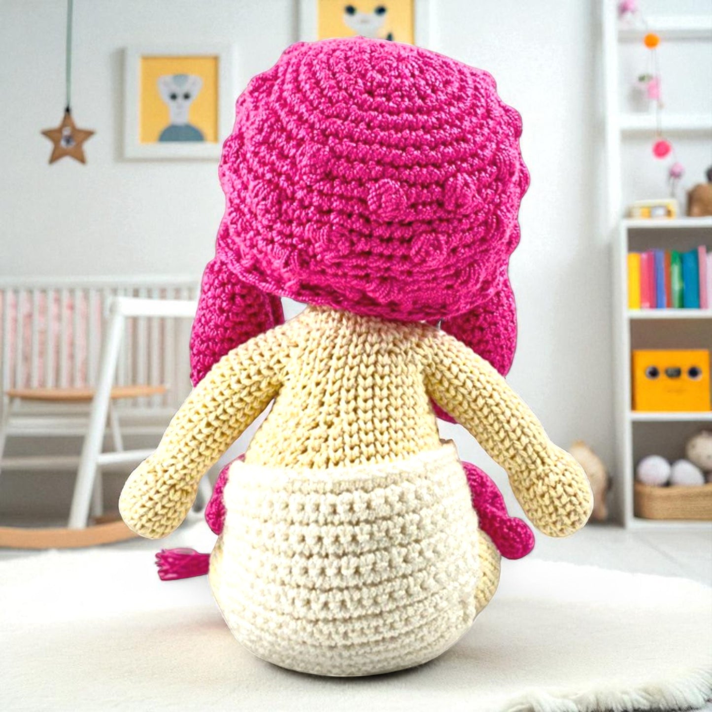 back view of handmade doll with pink cap