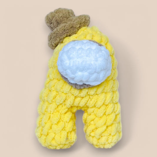 close of yellow handmade crochet Amongus plushy