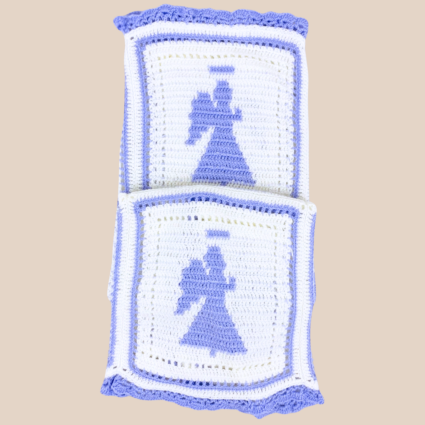 folded handcrochet blanket showing two angles 