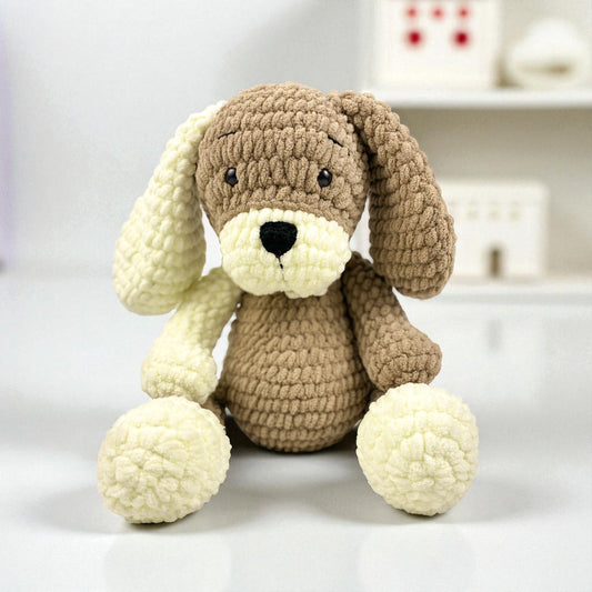 hand Crocheted dog toy with brown and cream colors on a white background