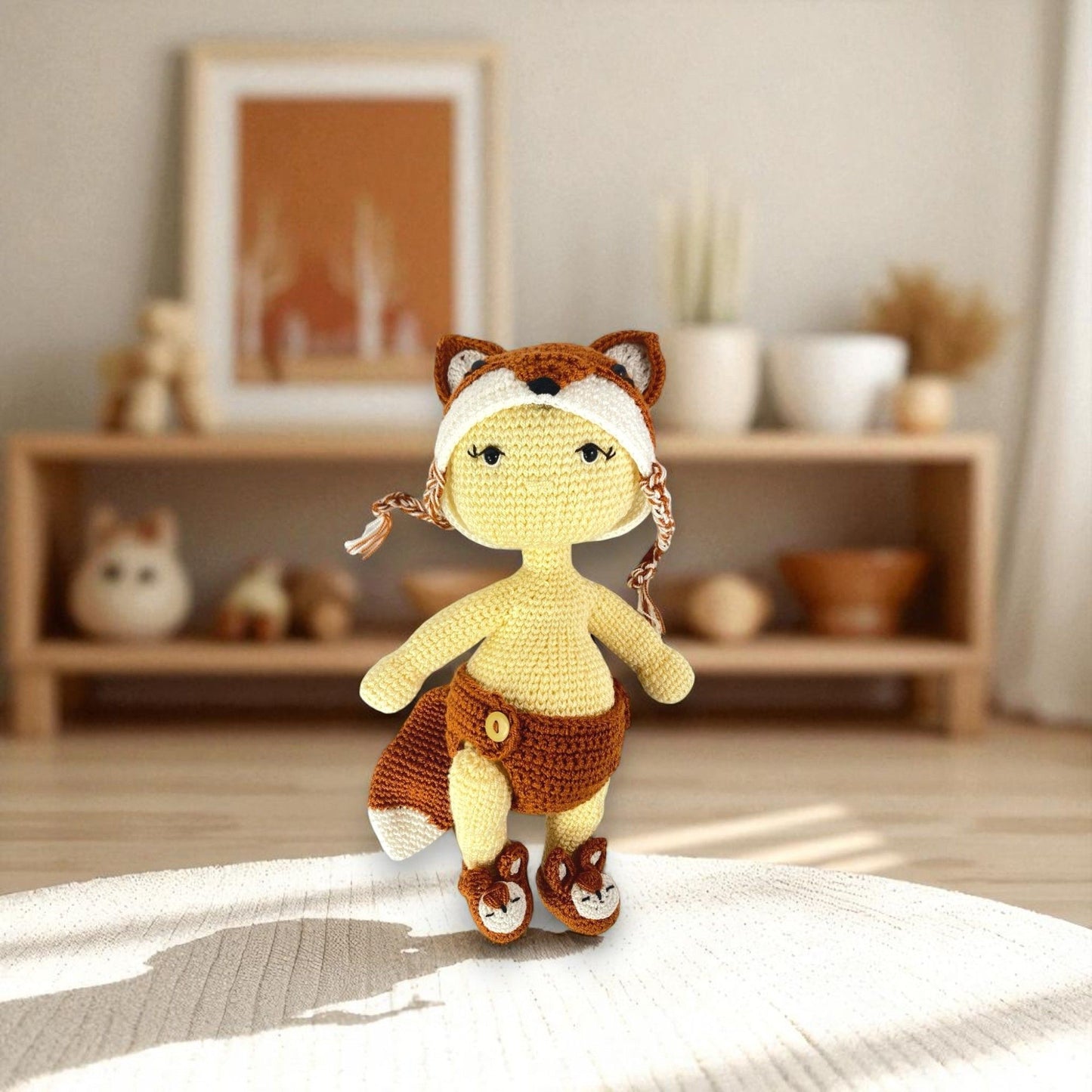 Crocheted toy resembling a fox with a human-like body on a bed in a cozy room.