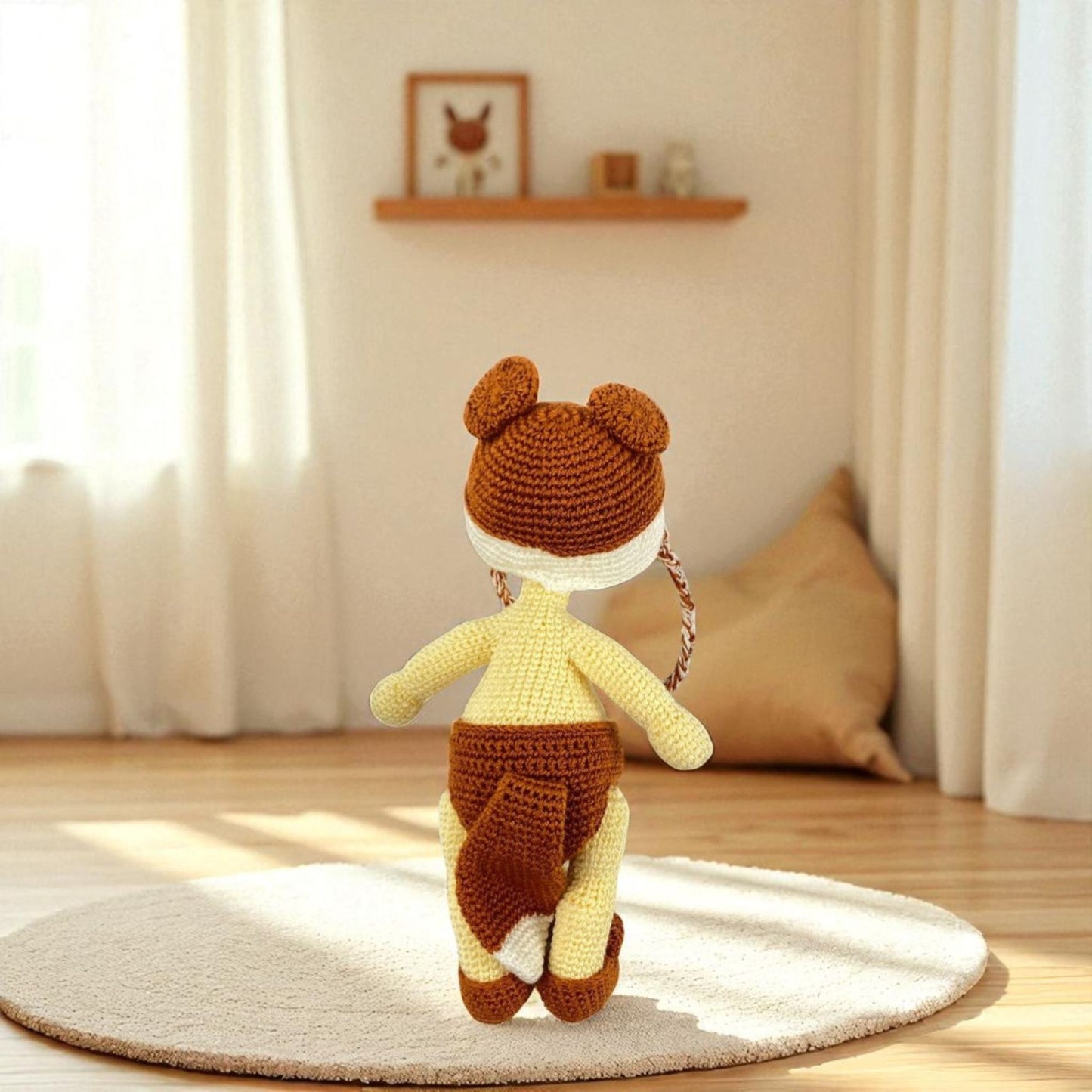 Crocheted bear toy on a rug in a room with curtains and a shelf.