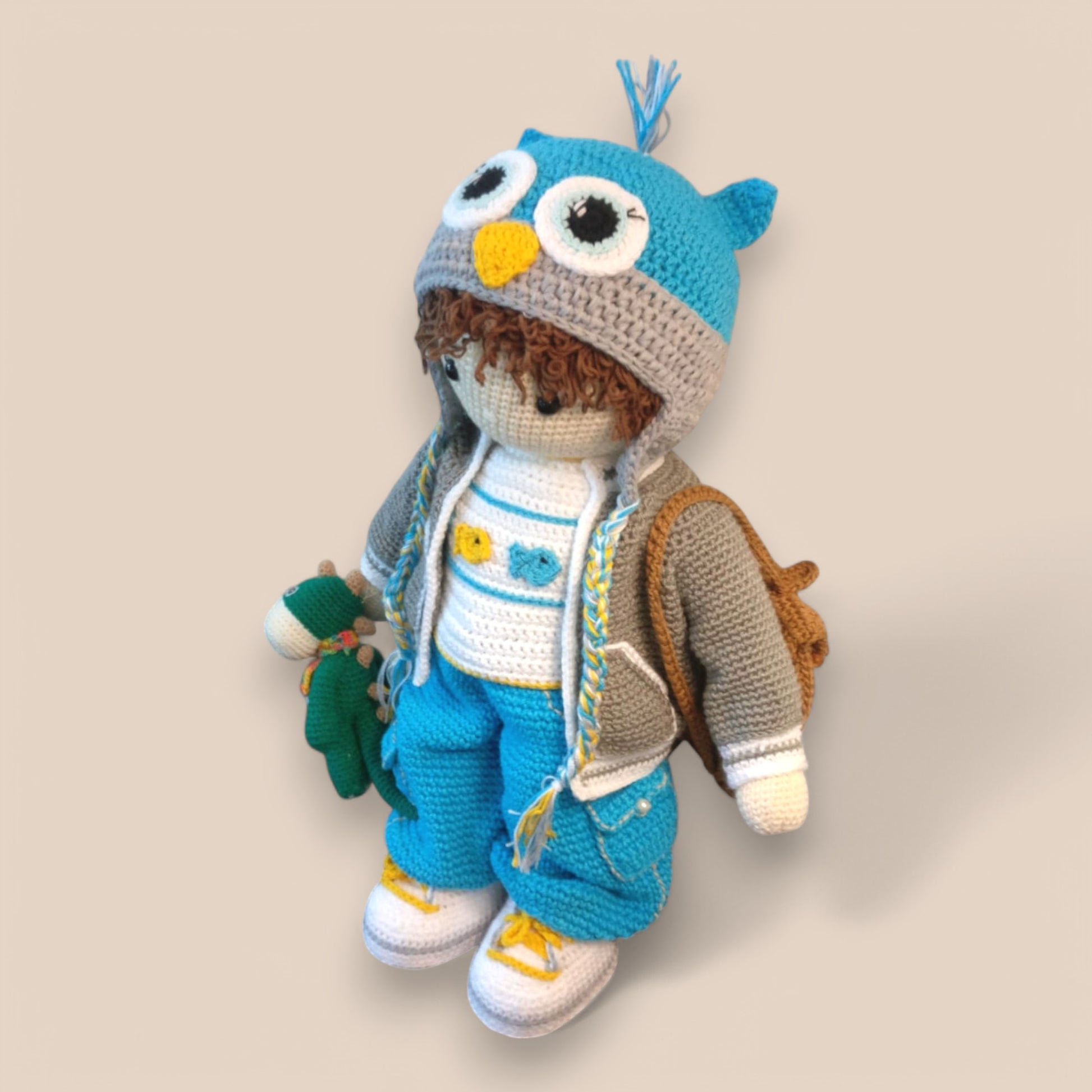 side view of Kyle Amigurumi ,crochet doll with bag on shoulder